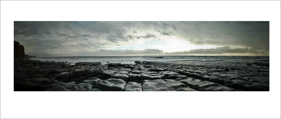 Digital landscape panoramic photograph of Cherhill Downs Monument with rainbow, Wiltshire