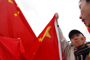 China supporters carry the national flag during the torch relay in London April 6, 2008