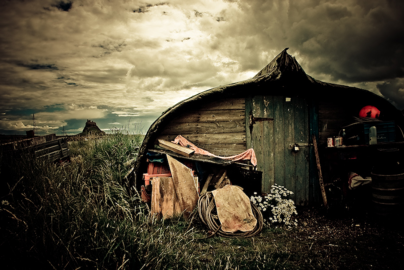 digital photograph image of upturned boat used as a shed, Holy Island of Lindisfarne, Northumberland