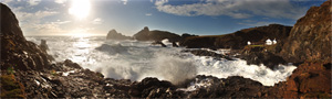 digital panoramic photograph of waves crashing against the rocks at Kynance Cove, Cornwall 